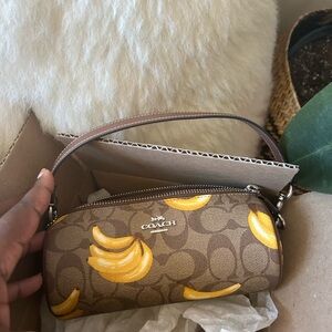 Nolita Barrel Bag In Signature Canvas With Banana Print